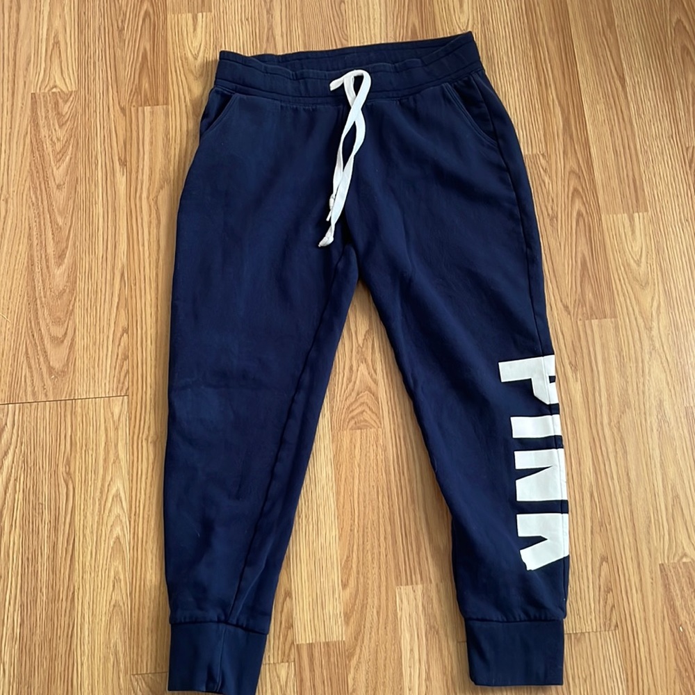 This is a PINK pair of blue sweatpants they ARE used
